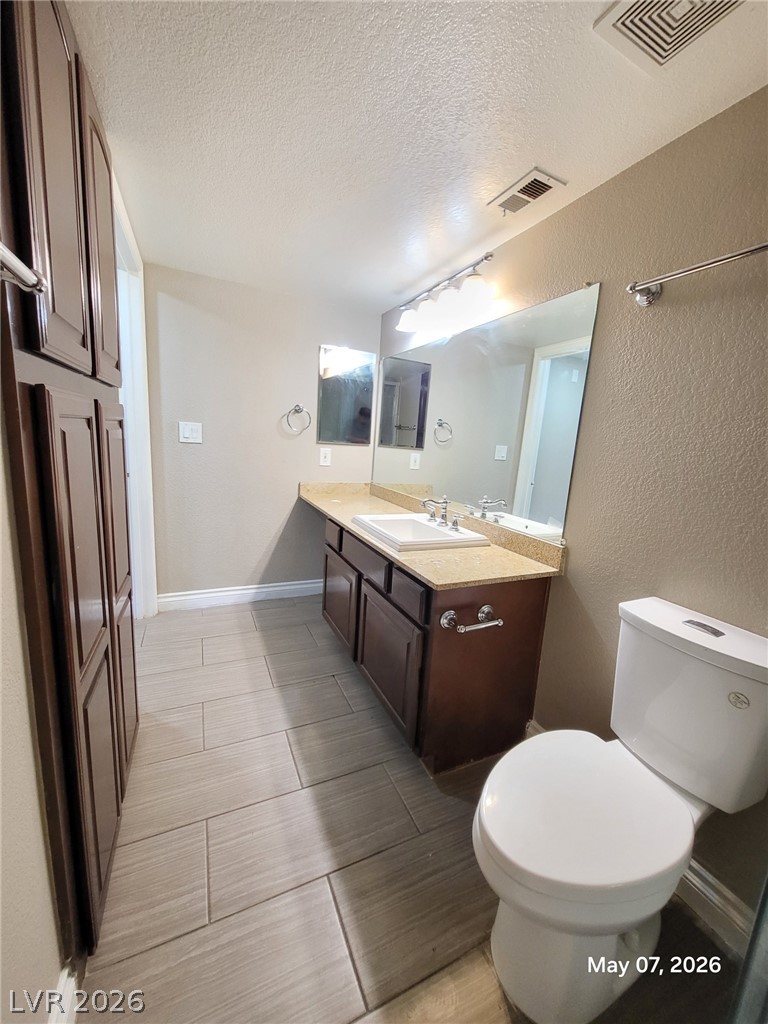 8101 West Flamingo Road, Unit 1160 Las Vegas, NV 89147 - Photo 13 of 18 This clean bathroom offers practical amenities and a bright atmosphere.
