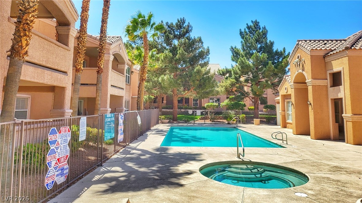 8101 West Flamingo Road, Unit 1160 Las Vegas, NV 89147 - Photo 16 of 18 An inviting outdoor pool and spa area awaits within this charming community setting.