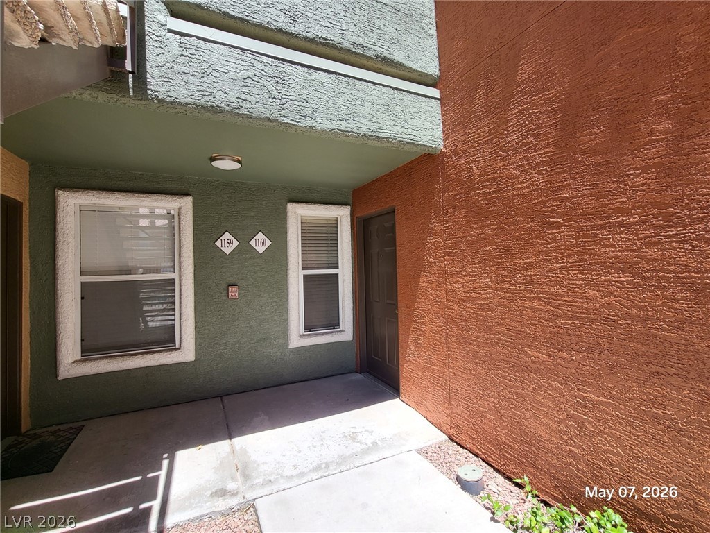 8101 West Flamingo Road, Unit 1160 Las Vegas, NV 89147 - Photo 2 of 18 This exterior view showcases textured walls and a welcoming entrance with natural light.