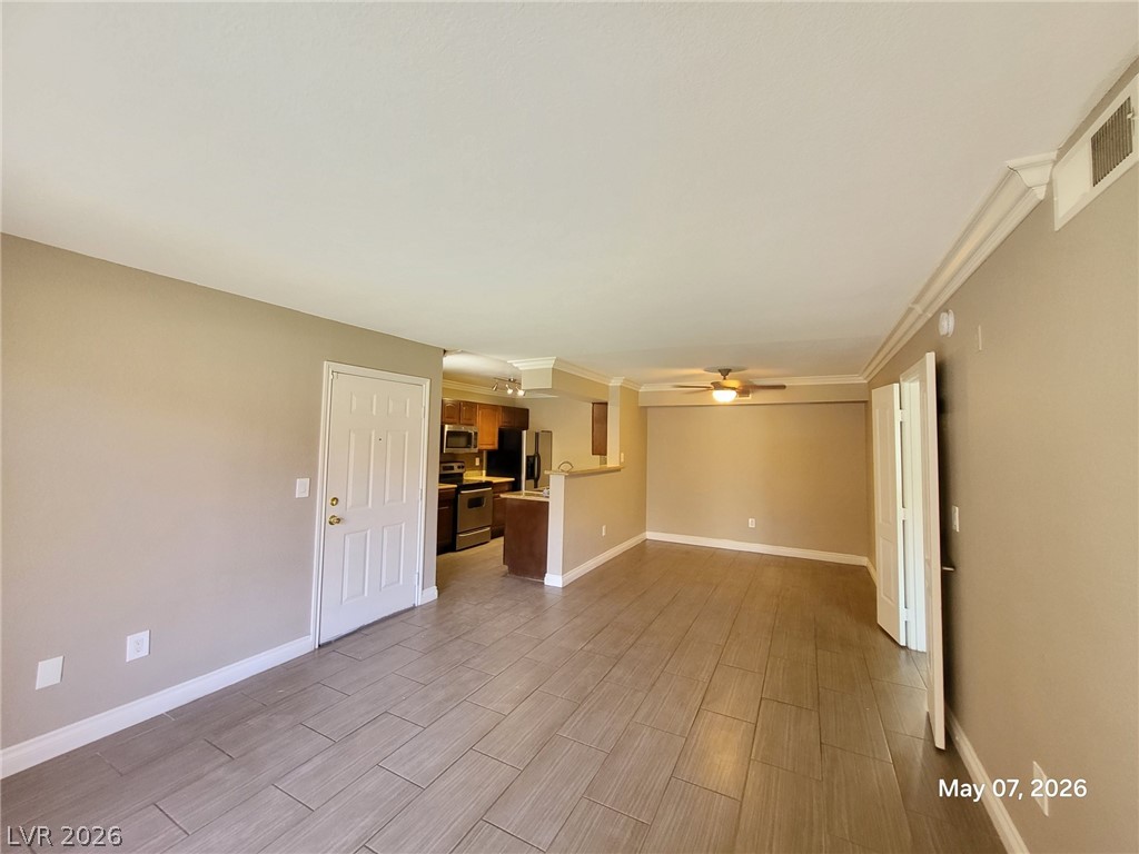 8101 West Flamingo Road, Unit 1160 Las Vegas, NV 89147 - Photo 4 of 18 This inviting space offers a seamless transition between living areas and a well-appointed kitchen.