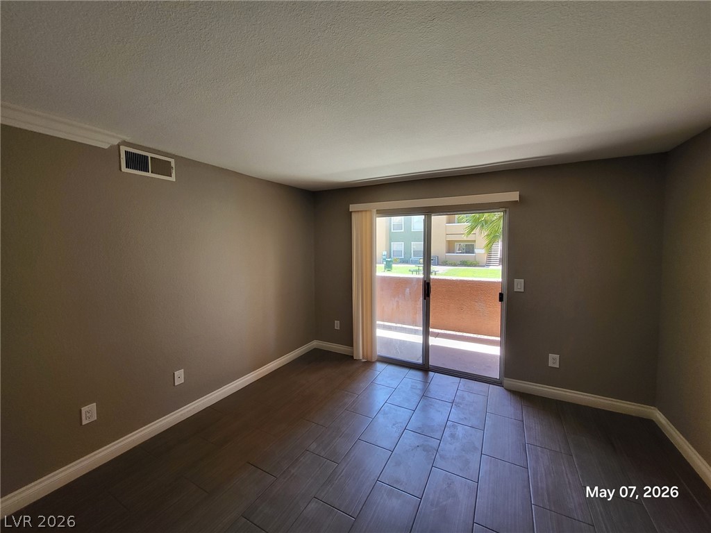 8101 West Flamingo Road, Unit 1160 Las Vegas, NV 89147 - Photo 5 of 18 This versatile room features durable flooring and convenient outdoor access.
