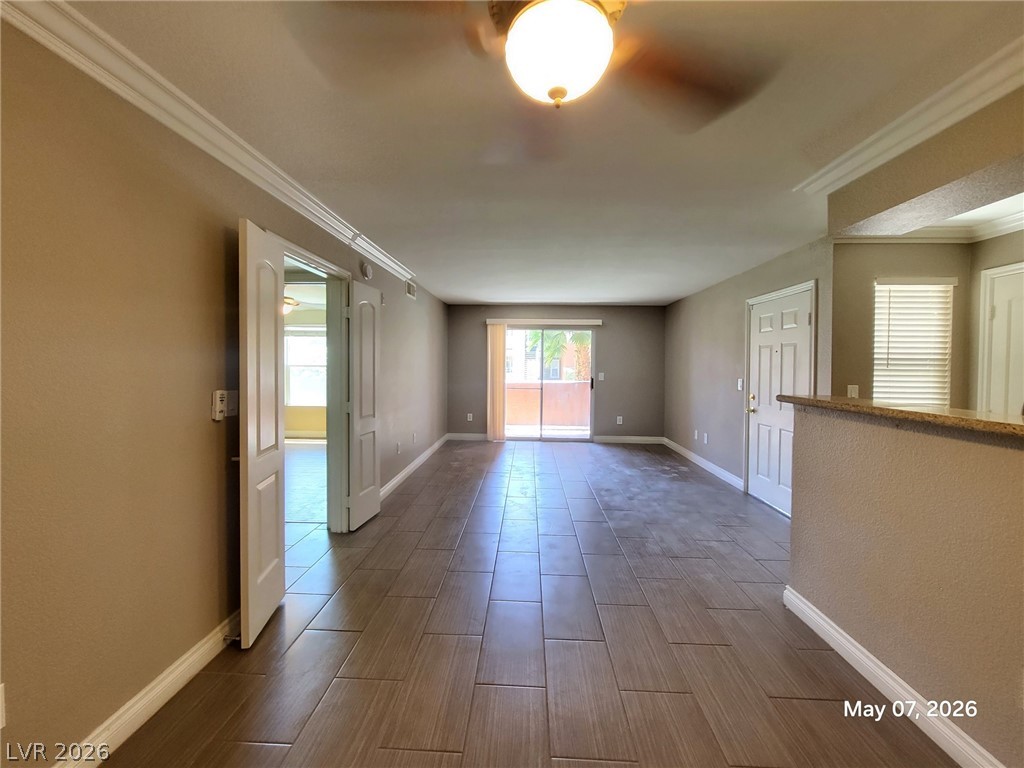 8101 West Flamingo Road, Unit 1160 Las Vegas, NV 89147 - Photo 8 of 18 The spacious living area features tiled flooring and convenient patio access.