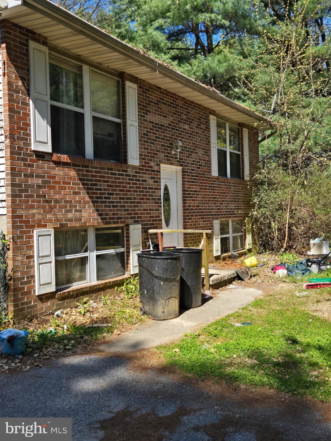 2480 Lewis Lane Finksburg, MD 21048 - Photo 2 of 7 a view of a patio with table and chairs and potted plants