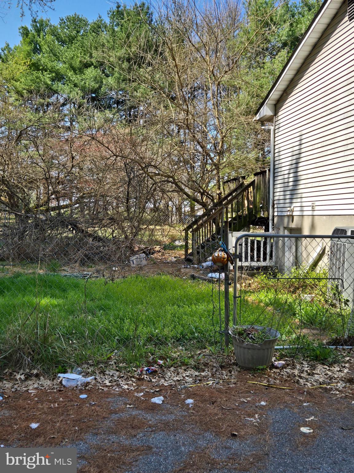 2480 Lewis Lane Finksburg, MD 21048 - Photo 6 of 7 a view of a street with a bench and large trees