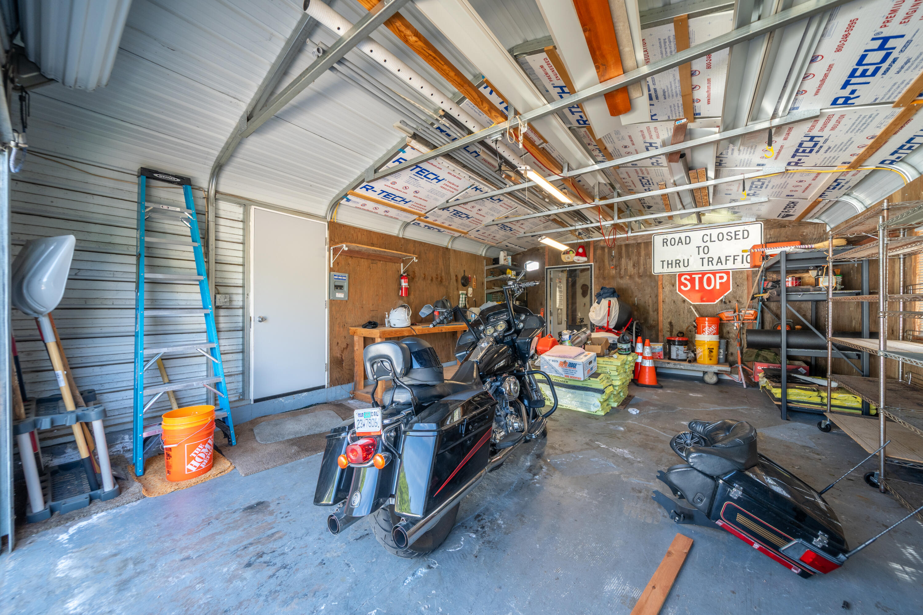 22151 Ravine Court Redding, CA 96003 - Photo 30 of 34 a view of a garage with a bike and car