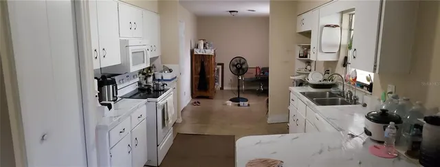 a view of living room with furniture and a flat screen tv