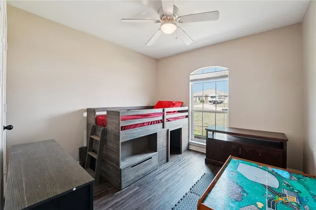 a room with furniture and a wooden floor