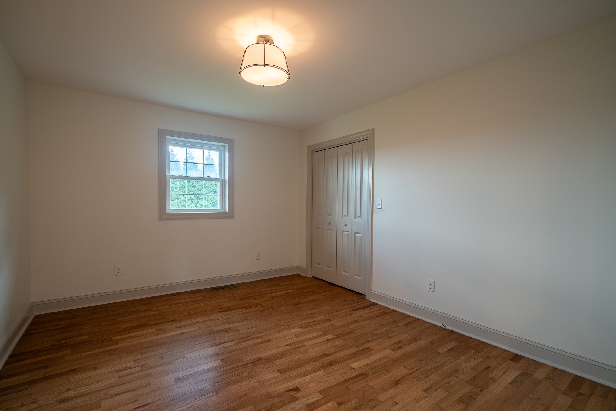 116 Smith Circle Loretto, TN 38469 - Photo 14 of 23 wooden floor in an empty room with a window