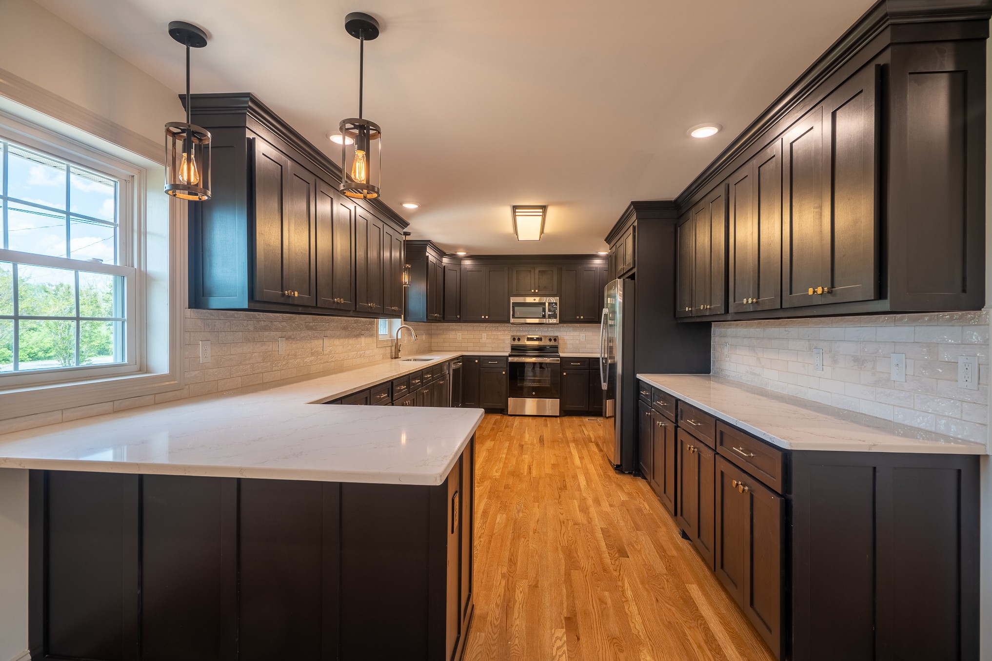 116 Smith Circle Loretto, TN 38469 - Photo 2 of 23 a kitchen with stainless steel appliances granite countertop wooden cabinets a oven and a sink