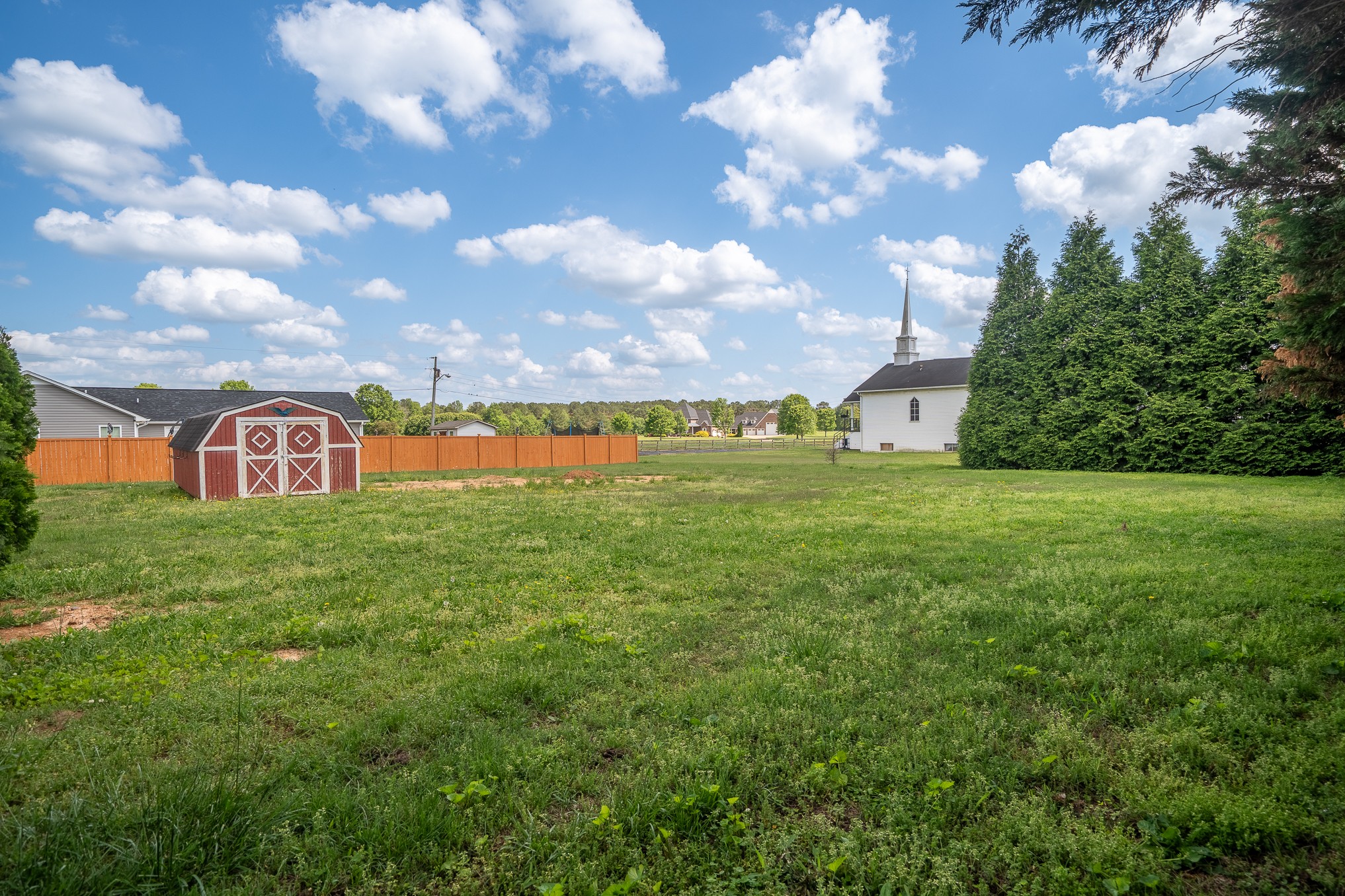 116 Smith Circle Loretto, TN 38469 - Photo 23 of 23 a view of a lake with a building in the background