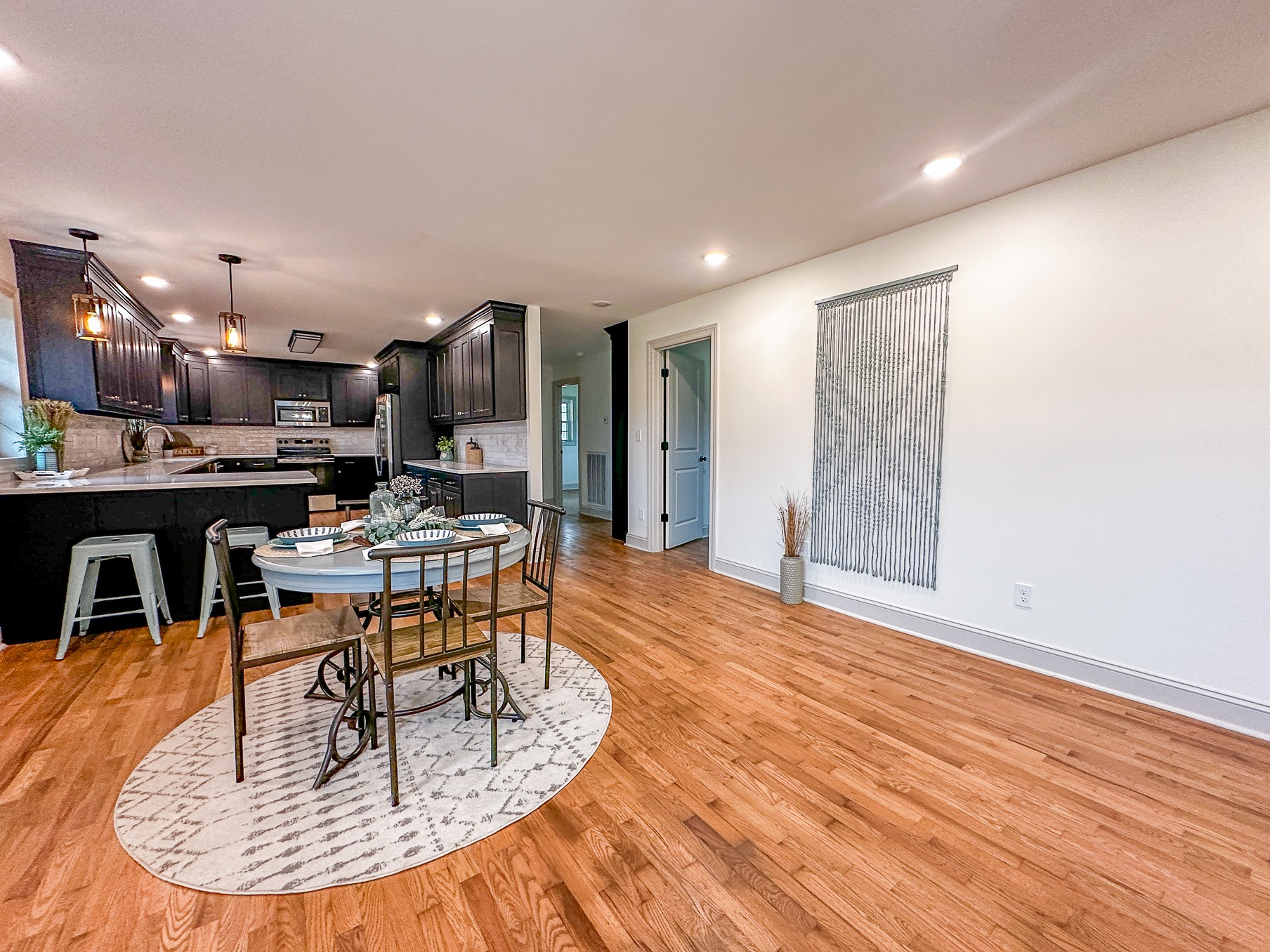 116 Smith Circle Loretto, TN 38469 - Photo 4 of 23 a dining room with stainless steel appliances kitchen island granite countertop a dining table chairs and view living room