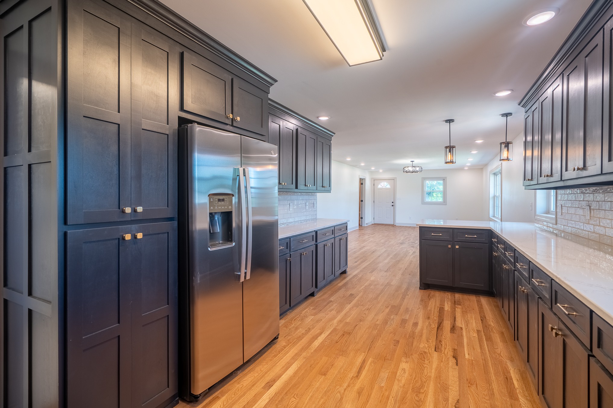 116 Smith Circle Loretto, TN 38469 - Photo 9 of 23 a kitchen with stainless steel appliances granite countertop a refrigerator a sink and wooden cabinets