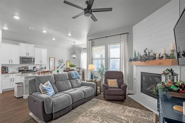 a living room with furniture and a fireplace