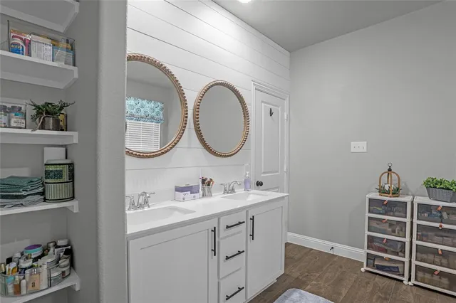 a bathroom with a sink and a mirror