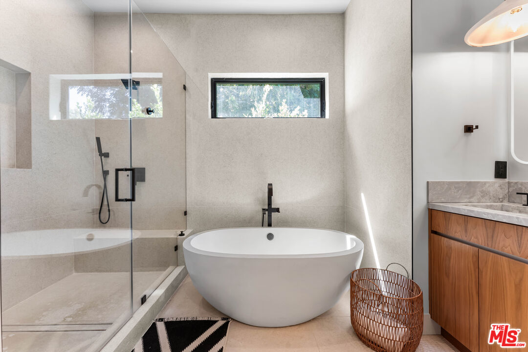 13463 Chandler Boulevard Sherman Oaks, CA 91401 - Photo 25 of 38 a bathroom with a sink and a mirror