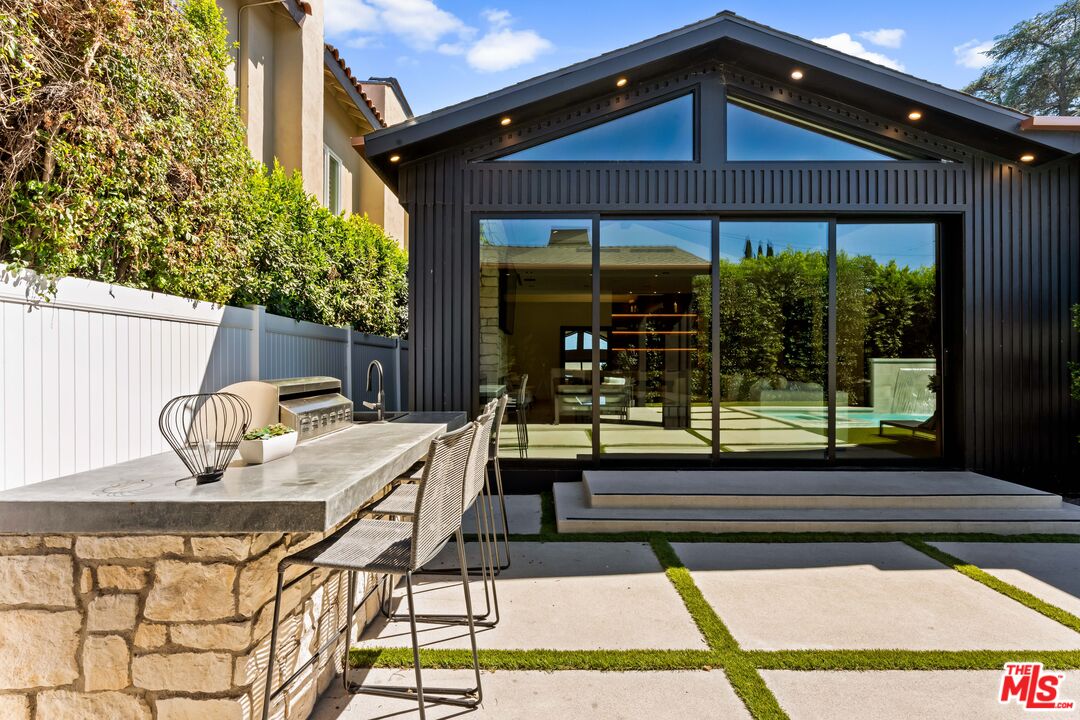13463 Chandler Boulevard Sherman Oaks, CA 91401 - Photo 35 of 38 a view of house with a large window and wooden floor