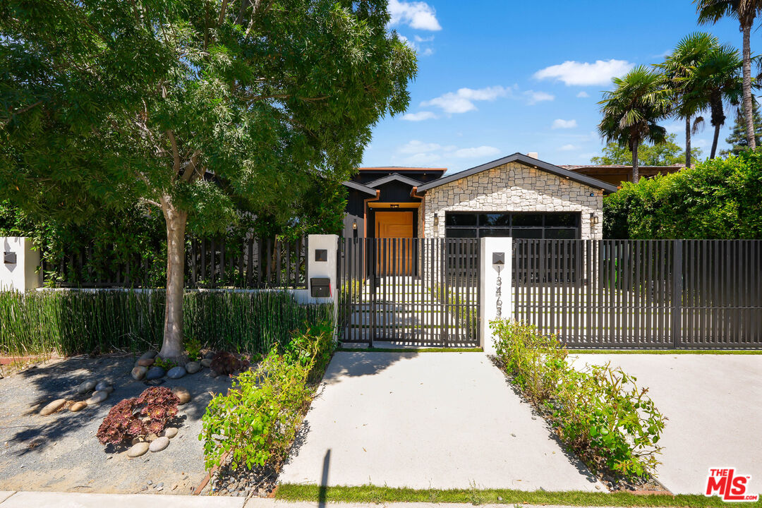 13463 Chandler Boulevard Sherman Oaks, CA 91401 - Photo 37 of 38 a front view of a house with a garden