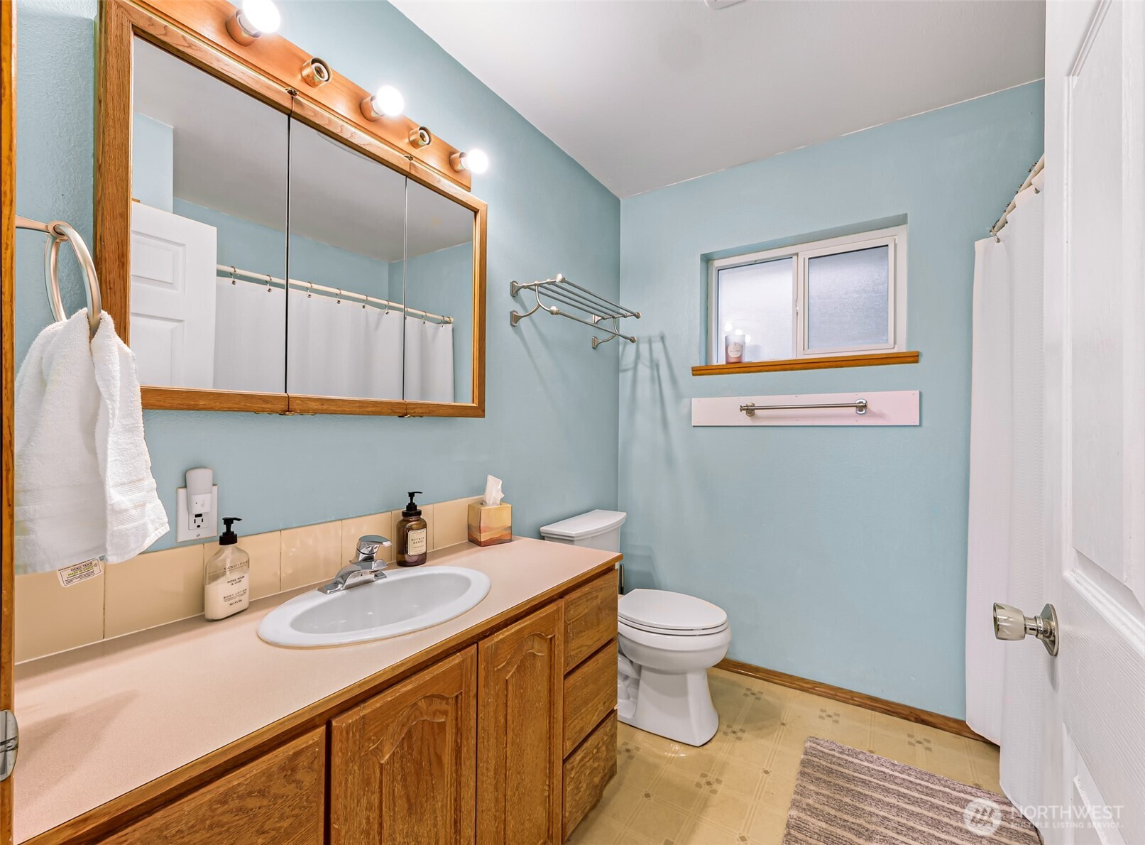 4610 Curtis Road Bellingham, WA 98226 - Photo 16 of 34 a bathroom with a sink and a mirror