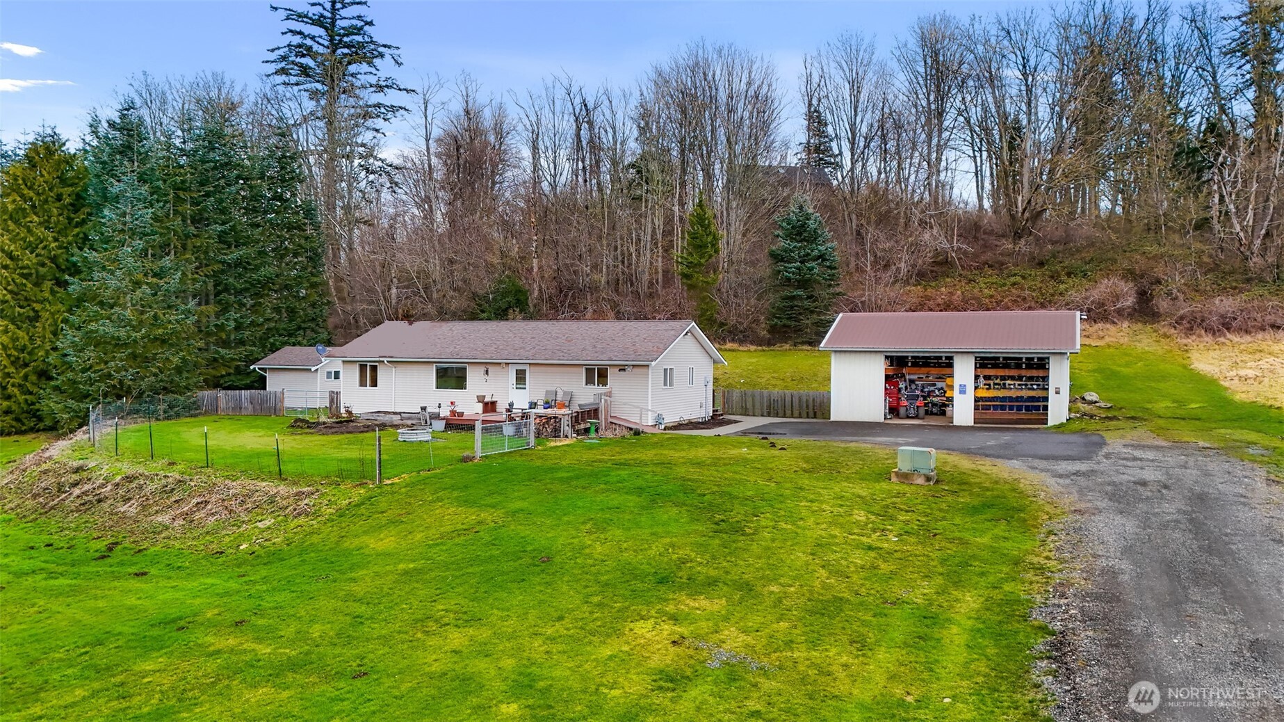 4610 Curtis Road Bellingham, WA 98226 - Photo 23 of 34 a view of a big house with a big yard plants and large trees