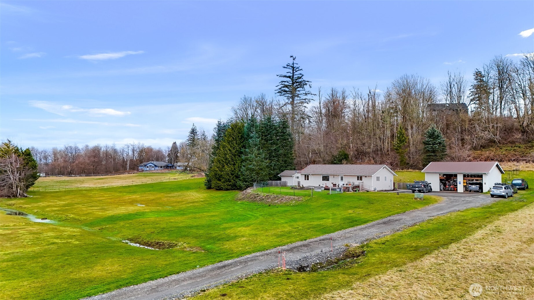 4610 Curtis Road Bellingham, WA 98226 - Photo 26 of 34 a view of a house with a yard and sitting area