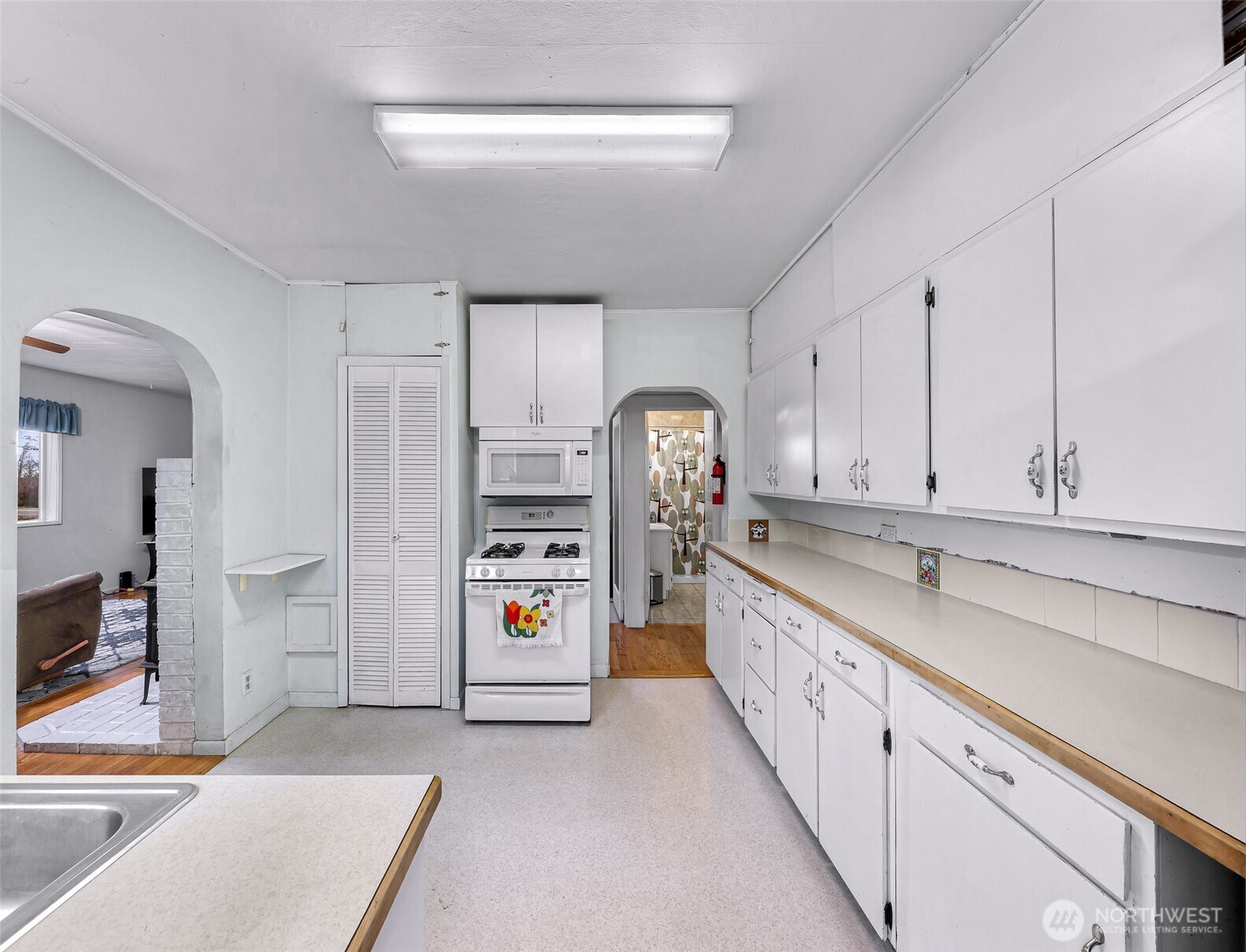 4610 Curtis Road Bellingham, WA 98226 - Photo 27 of 34 a kitchen with stainless steel appliances kitchen island granite countertop a refrigerator and cabinets