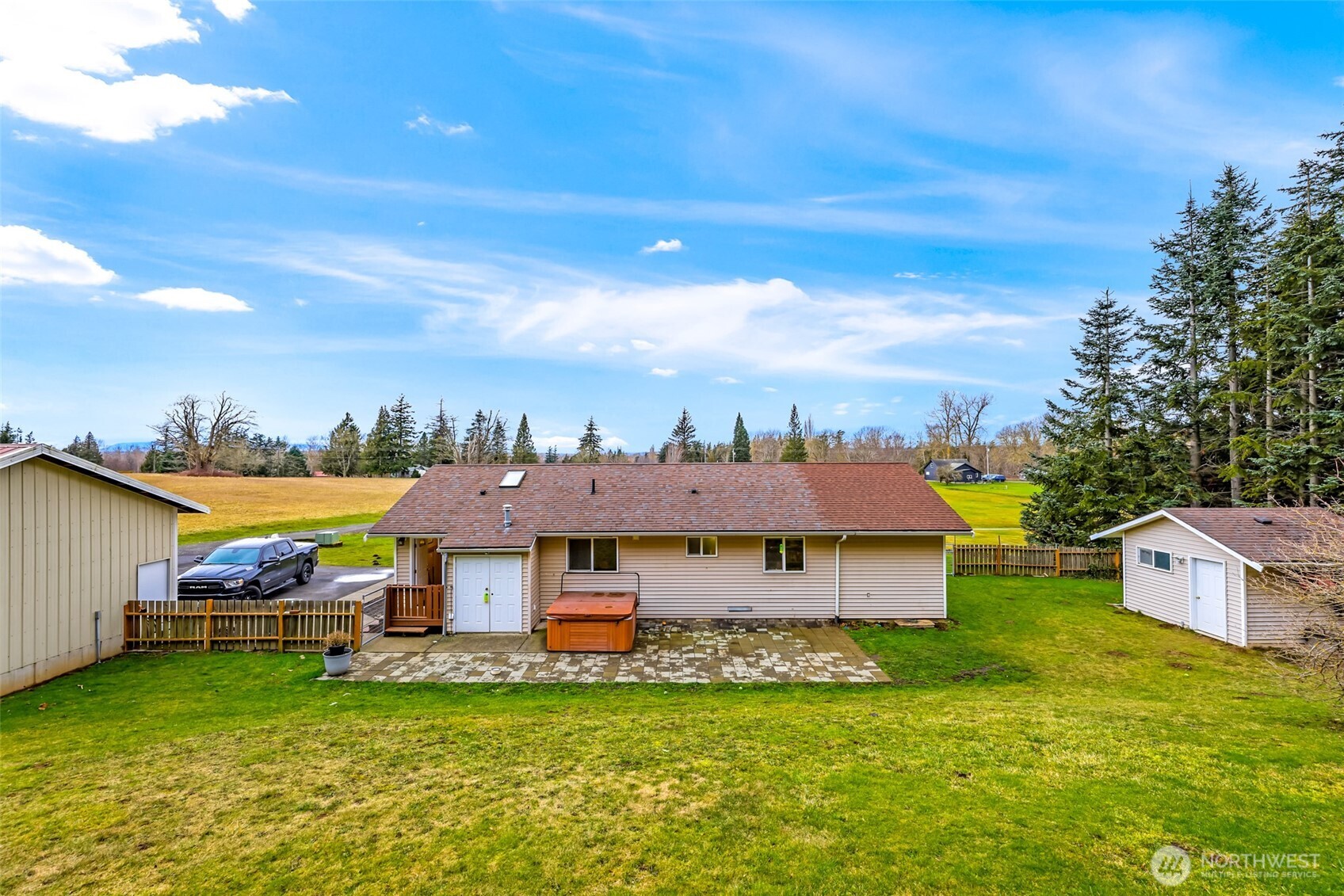 4610 Curtis Road Bellingham, WA 98226 - Photo 3 of 34 a view of a big house with a big yard and large trees