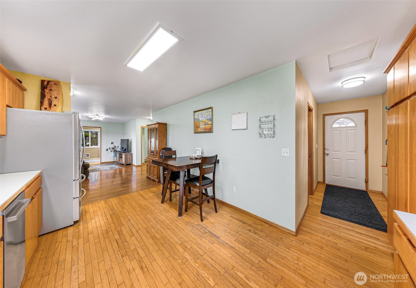 4610 Curtis Road Bellingham, WA 98226 - Photo 4 of 34 a view of a dining room with furniture and wooden floor
