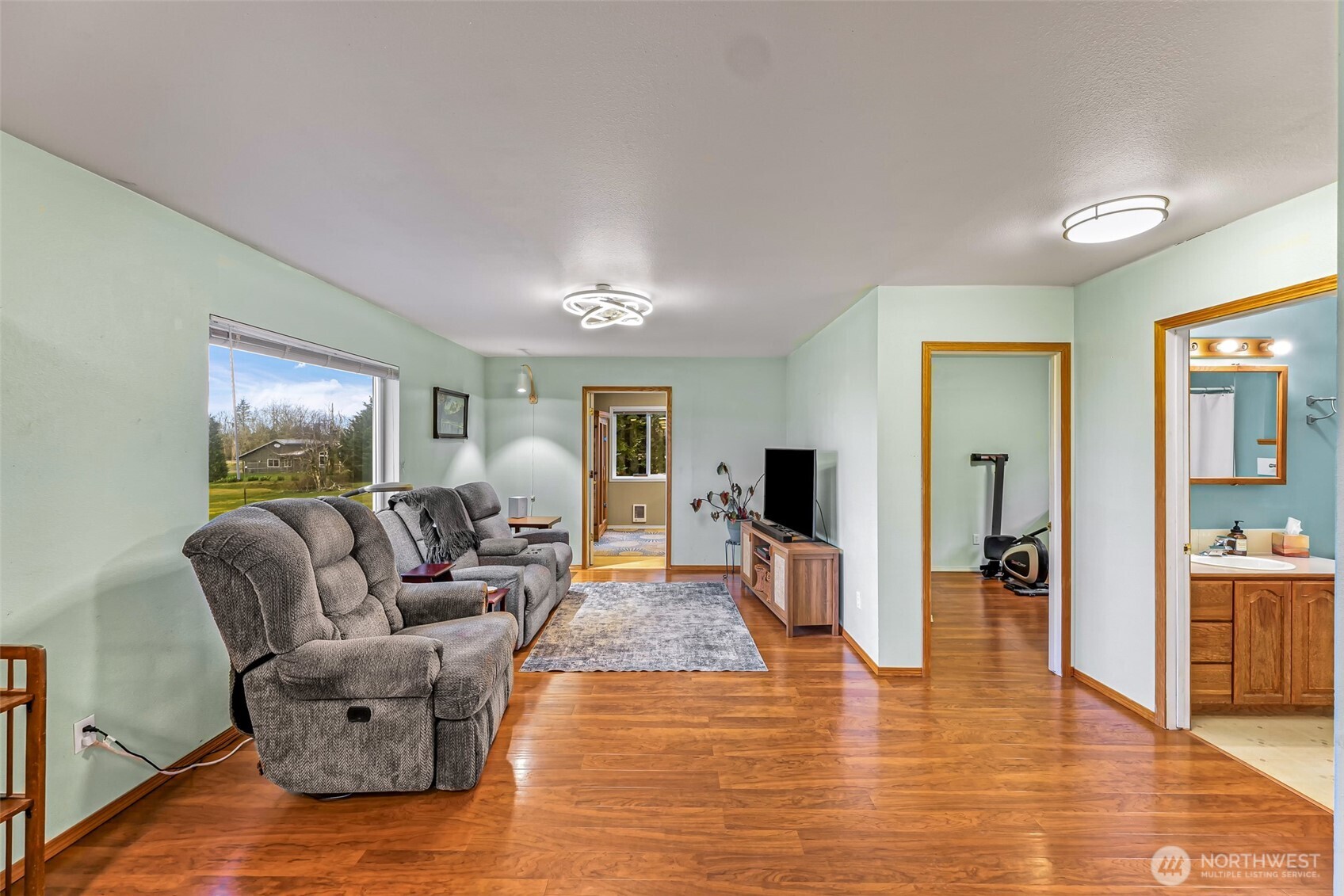 4610 Curtis Road Bellingham, WA 98226 - Photo 10 of 34 a living room with furniture and a wooden floor