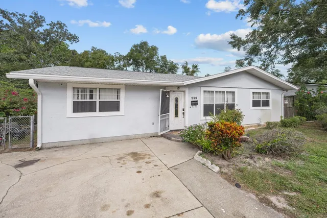 a backyard of a house with seating space
