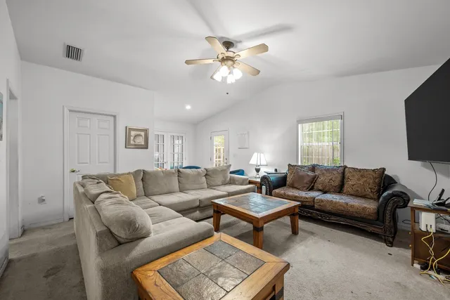 a bedroom with furniture and a chandelier