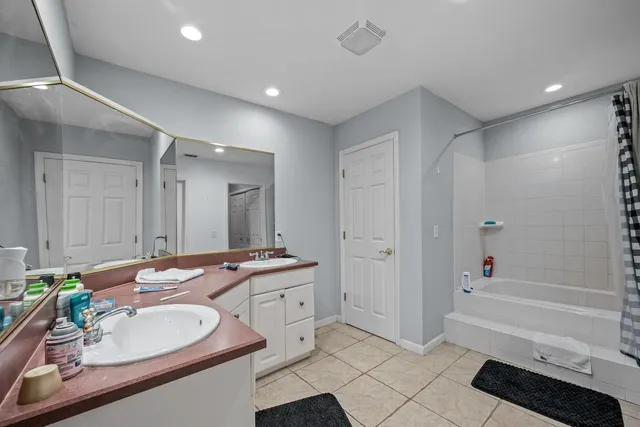 a bedroom with furniture and a chandelier