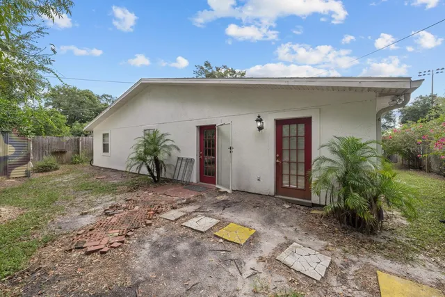 a view of a house with a plants and garage