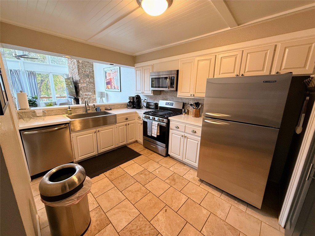 Undisclosed Address Austin, TX 78746 - Photo 2 of 26 a kitchen with a refrigerator sink and stove