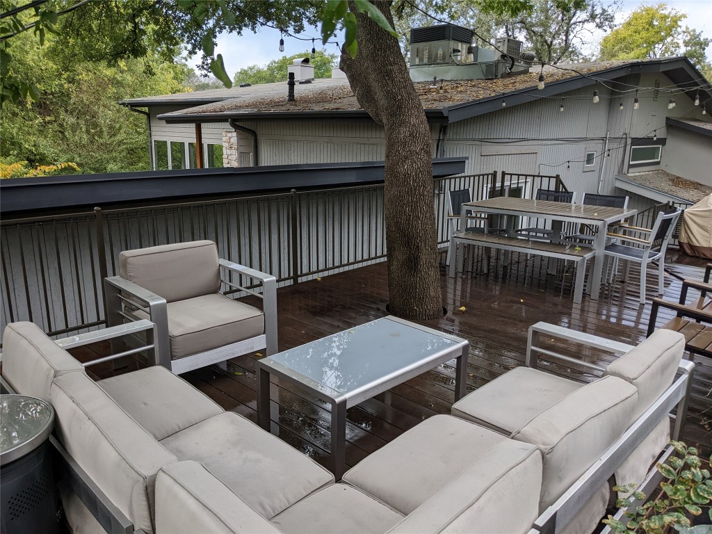 Undisclosed Address Austin, TX 78746 - Photo 23 of 26 a view of a patio with couches table and chairs with wooden floor