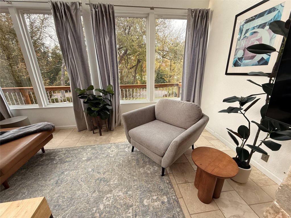 Undisclosed Address Austin, TX 78746 - Photo 3 of 26 a living room with furniture and a floor to ceiling window