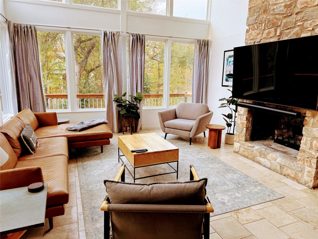 Undisclosed Address Austin, TX 78746 - Photo 5 of 26 a living room with furniture a flat screen tv and a large window