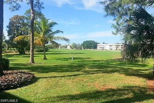 a view of a golf course with a garden