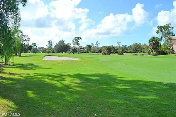 a view of a golf course with a lake