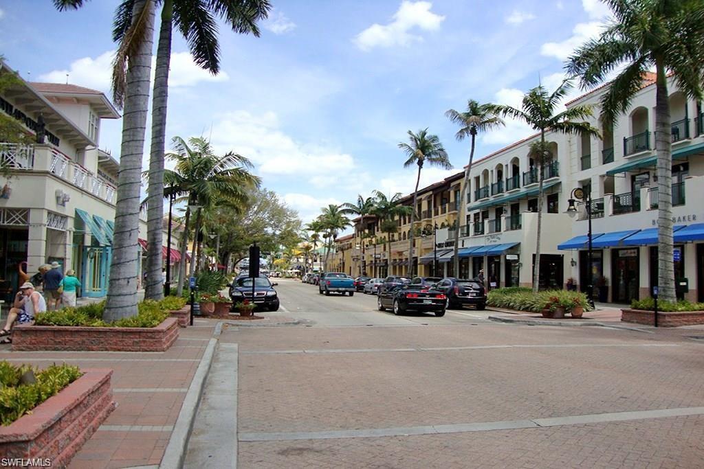 4007 Recreation Lane Naples, FL 34116 - Photo 19 of 24 a city street lined with buildings and trees