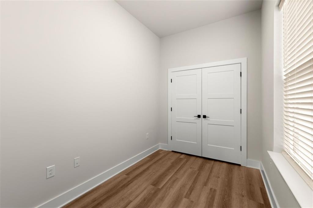 2648 Sandy Plains Road, Unit 301 Marietta, GA 30062 - Photo 13 of 46 wooden floor in an empty room