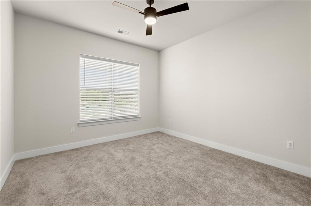 2648 Sandy Plains Road, Unit 301 Marietta, GA 30062 - Photo 19 of 46 an empty room with a window