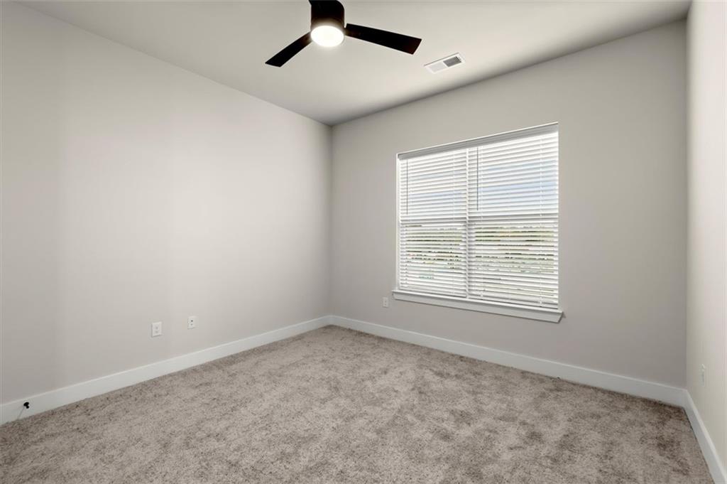 2648 Sandy Plains Road, Unit 301 Marietta, GA 30062 - Photo 22 of 46 an empty room with a window