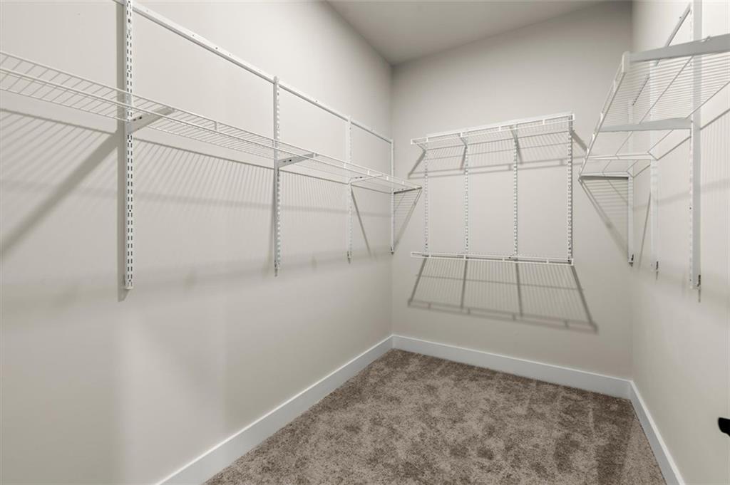 2648 Sandy Plains Road, Unit 301 Marietta, GA 30062 - Photo 26 of 46 a view of a room with racks on the wall