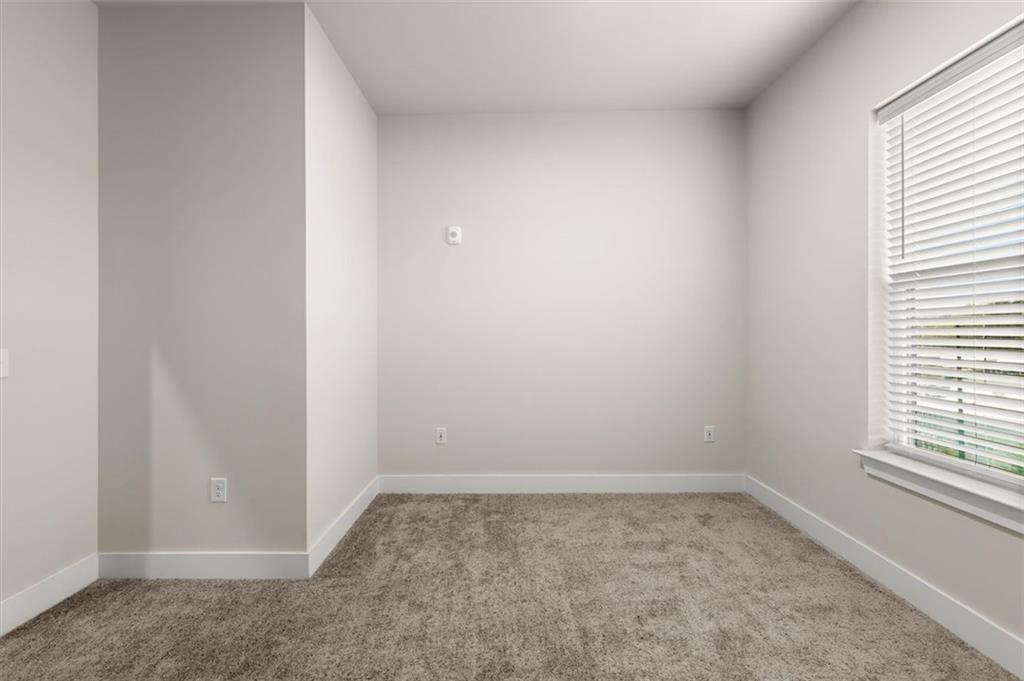 2648 Sandy Plains Road, Unit 301 Marietta, GA 30062 - Photo 31 of 46 an empty room with a window