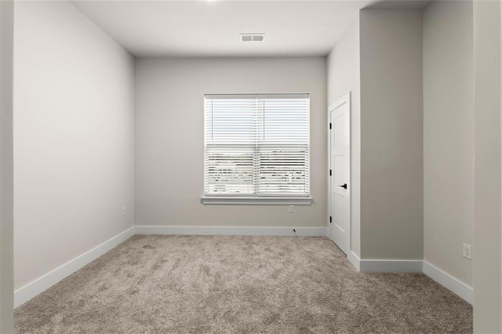 2648 Sandy Plains Road, Unit 301 Marietta, GA 30062 - Photo 33 of 46 an empty room with a window