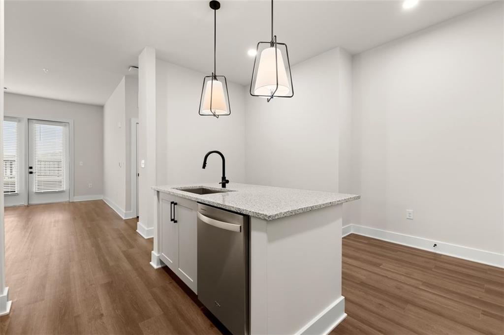 2648 Sandy Plains Road, Unit 301 Marietta, GA 30062 - Photo 6 of 46 a view of a kitchen with a sink and wooden floor