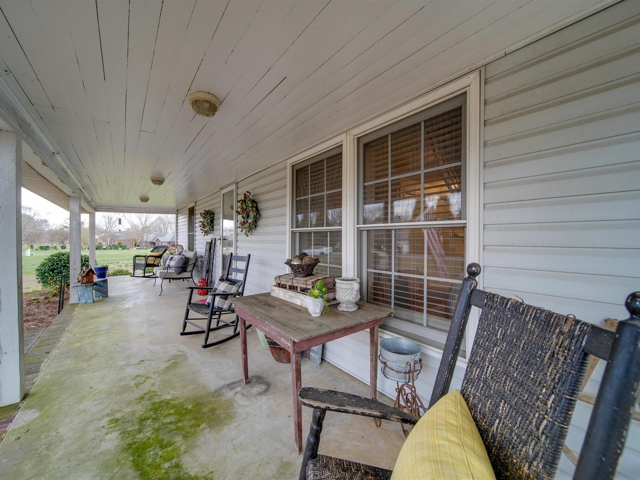 3410 Helms Pond Road Monroe, NC 28110 - Photo 12 of 35 a view of the patio with a table and chairs