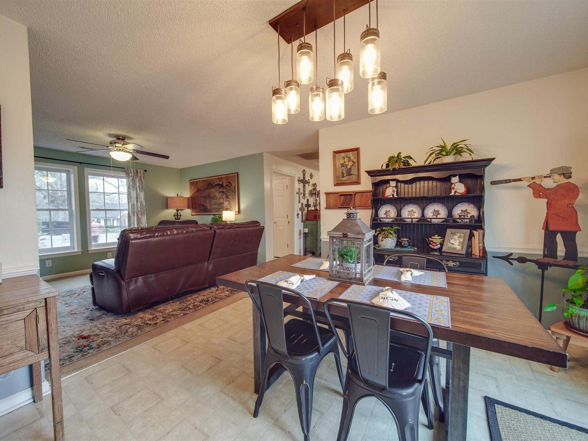 3410 Helms Pond Road Monroe, NC 28110 - Photo 14 of 35 a view of a dining room with furniture and chandelier