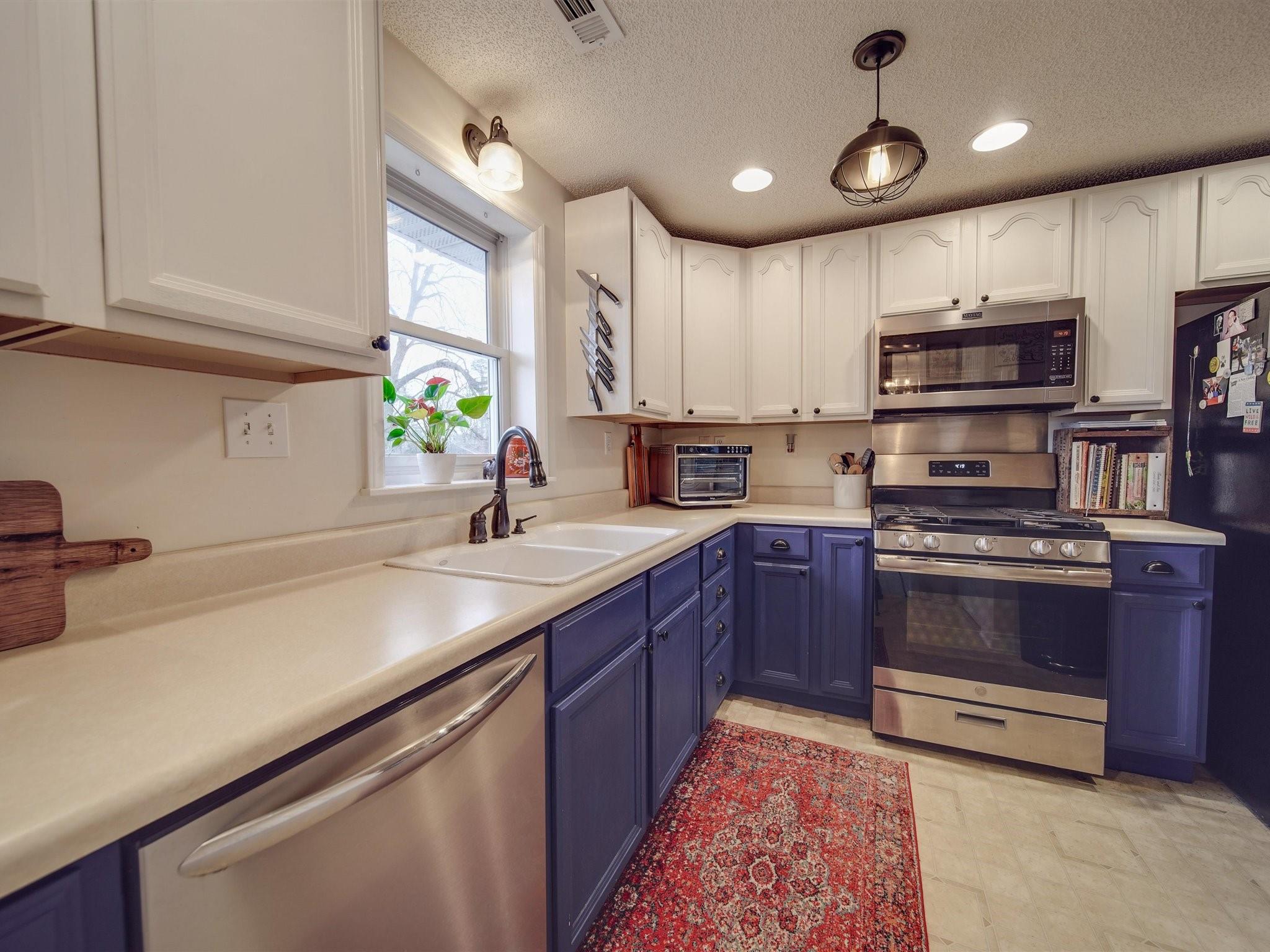 3410 Helms Pond Road Monroe, NC 28110 - Photo 20 of 35 a kitchen with stainless steel appliances granite countertop a sink stove and microwave