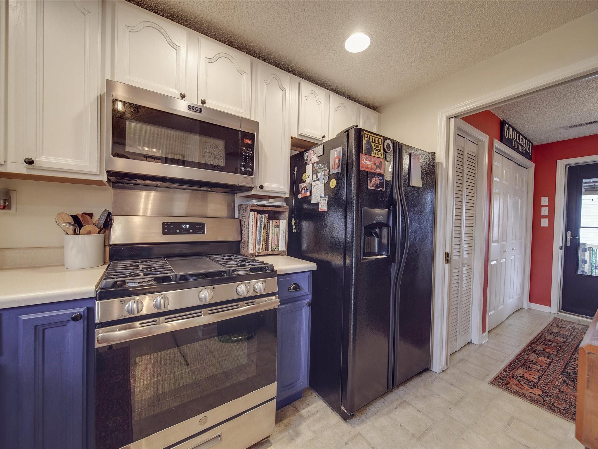 3410 Helms Pond Road Monroe, NC 28110 - Photo 21 of 35 a kitchen with stainless steel appliances granite countertop a refrigerator stove and cabinets